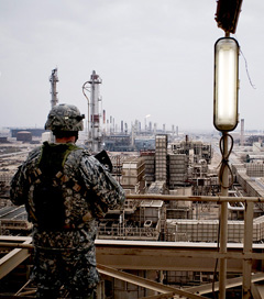 A US soldier looks over the Baiji Refinery in Baiji, Iraq, December 16, 2009. (Photo: Ayman Oghanna / The New York Times)